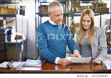 Document, warehouse and team of business people in discussion for shipping, storage or distribution with senior manager. Factory, paper and logistics for inventory or stock or collaboration at table Document, warehouse and team of business people in discussion for shipping, storage or distribution with senior manager. Factory, paper and logistics for inventory or stock or collaboration at table 141180885