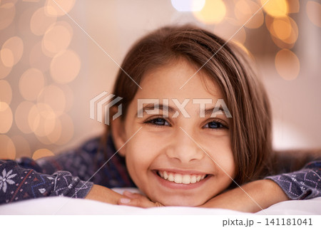 Kids, portrait and happy girl relax in a house for vacation, resting or break with light and bokeh background. Face, smile and innocent female child person in a living room for holiday or weekend 141181041