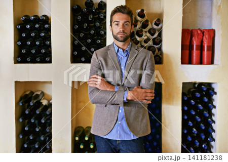 Wine cellar, man and portrait with alcohol, seller and drink choice of sommelier and inventory. Winery, confidence and shelf with shop worker with vintage selection of liquor at a store or restaurant Wine cellar, man and portrait with alcohol, seller and drink choice of sommelier and inventory. Winery, confidence and shelf with shop worker with vintage selection of liquor at a store or restaurant 141181238