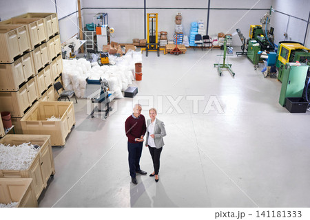 Factory, warehouse and portrait of business people with tablet for logistics, training and management. Mature man, woman and partnership with tech for planning, teamwork or distribution from above Factory, warehouse and portrait of business people with tablet for logistics, training and management. Mature man, woman and partnership with tech for planning, teamwork or distribution from above 141181333