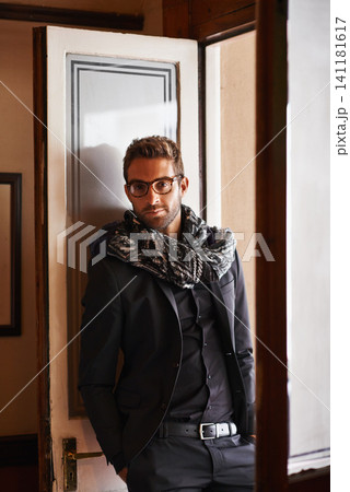 Man, portrait and fashion in house for style and clothes for bold and trendy indoor. Young person, smile and handsome with scarf and jacket for winter wear and comfort for edgy and aesthetic Man, portrait and fashion in house for style and clothes for bold and trendy indoor. Young person, smile and handsome with scarf and jacket for winter wear and comfort for edgy and aesthetic 141181617