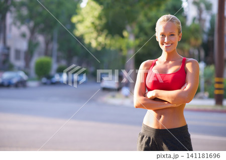 Happy woman, portrait and confidence with fitness in city for exercise, workout or outdoor training. Young female person, runner or athlete with smile for pride, health and wellness in an urban town Happy woman, portrait and confidence with fitness in city for exercise, workout or outdoor training. Young female person, runner or athlete with smile for pride, health and wellness in an urban town 141181696