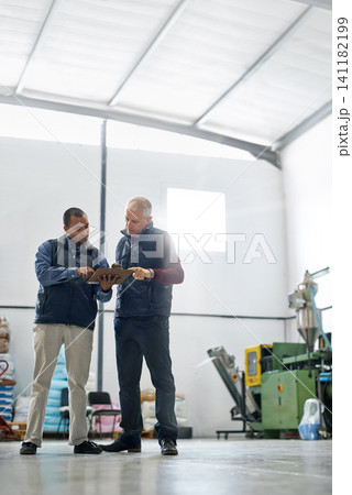 Warehouse, clipboard and business men with checklist for retail stock, cargo or quality control inspection. Ecommerce, supply chain and factory team with logistics, planning or brainstorming solution Warehouse, clipboard and business men with checklist for retail stock, cargo or quality control inspection. Ecommerce, supply chain and factory team with logistics, planning or brainstorming solution 141182199