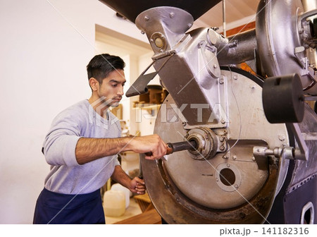 Man, machine and industry for grinding coffee with roast, process and flavor for export in factory. Person, employee and tools for caffeine, beans or press with manufacturing at warehouse in Colombia Man, machine and industry for grinding coffee with roast, process and flavor for export in factory. Person, employee and tools for caffeine, beans or press with manufacturing at warehouse in Colombia 141182316