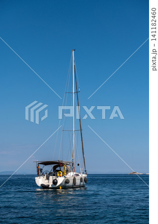 Luxury motor yacht sailing near rocky island in Marmaris Turkey Luxury motor yacht sailing near rocky island in Marmaris Turkey 141182460