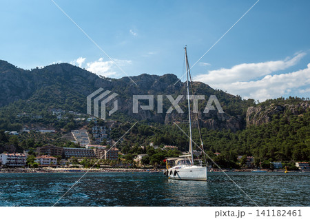 Luxury motor yacht sailing near rocky island in Marmaris Turkey Luxury motor yacht sailing near rocky island in Marmaris Turkey 141182461