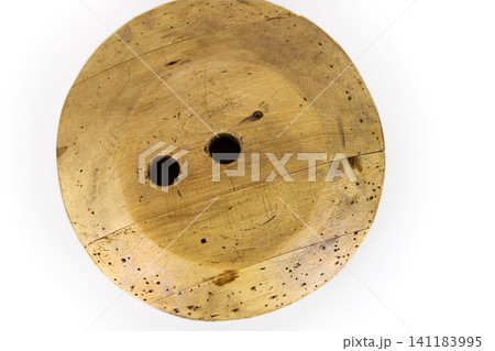 Antique millinery form for shaping wide brim for hats. Vintage wooden block used in hat making. Craftsmanship, old professions, artisan work concept. Isolated on white background. Copy space Antique millinery form for shaping wide brim for hats. Vintage wooden block used in hat making. Craftsmanship, old professions, artisan work concept. Isolated on white background. Copy space 141183995
