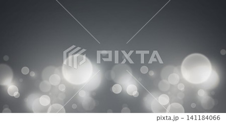 Grey background displaying soft, shimmering bokeh effect lights at the bottom Grey background displaying soft, shimmering bokeh effect lights at the bottom 141184066
