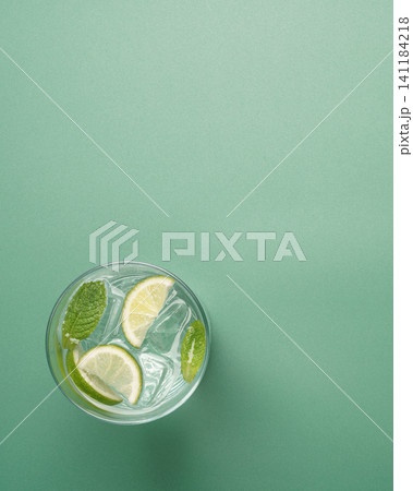 Refreshing mojito cocktail pastel green background Refreshing mojito cocktail pastel green background 141184218