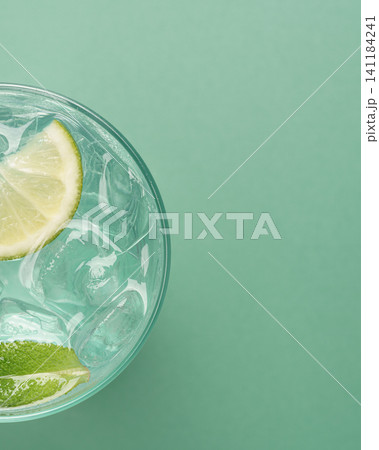 Minimal mojito cocktail transparent ice vertical Minimal mojito cocktail transparent ice vertical 141184241