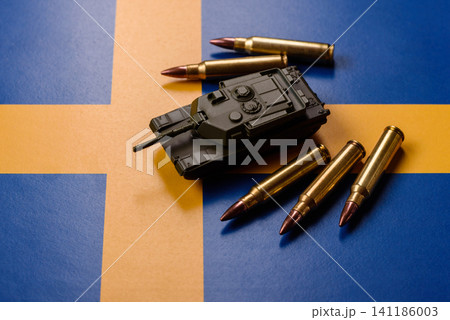 A tank on the Sweden flag as a conceptual backdrop representing Europe's defense A tank on the Sweden flag as a conceptual backdrop representing Europe's defense 141186003