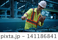 Ai using. Engineers and technicians use AI inspect industrial equipment. Worker using Ai digital tools and augmented reality technology to inspect industrial machinery. Smart ai factory innovation. 141186841