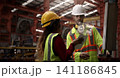 Ai using. Engineers and technicians use AI inspect industrial equipment. Worker using Ai digital tools and augmented reality technology to inspect industrial machinery. Smart ai factory innovation. 141186845