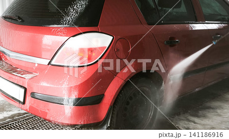 pressure washer cleaning red car, 141186916
