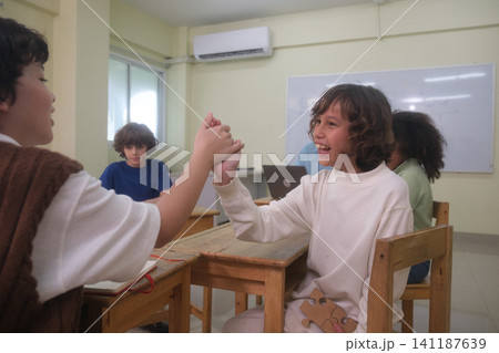 The young children are learning in the classroom. The young children are learning in the classroom. 141187639