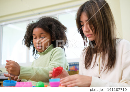 The young children are learning in the classroom. The young children are learning in the classroom. 141187710