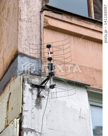 Vintage outdoor television and radio antenna fixed to balcony of high-rise residential block Vintage outdoor television and radio antenna fixed to balcony of high-rise residential block 141188097