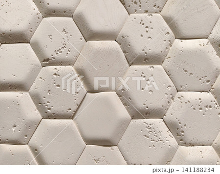 Light decorative panels with hexagon inspired texture shown in a hardware store section for modern interior renovation and design applications Light decorative panels with hexagon inspired texture shown in a hardware store section for modern interior renovation and design applications 141188234