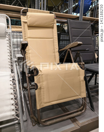 Folding chairs for fishing and tourism displayed in hypermarket provide portable seating comfort durable construction and practical design for outdoor activities and travel use Folding chairs for fishing and tourism displayed in hypermarket provide portable seating comfort durable construction and practical design for outdoor activities and travel use 141188250