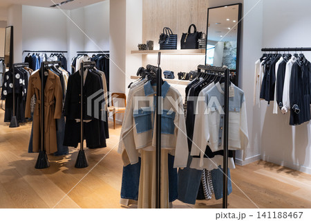 Fashion boutique interior with stylish clothes and accessories Fashion boutique interior with stylish clothes and accessories 141188467