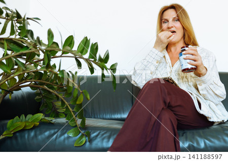 woman middle age medicine capsule health 141188597
