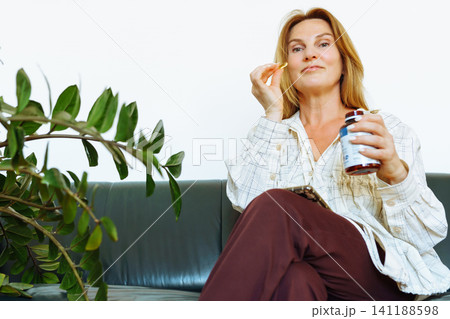 woman middle age medicine capsule health woman middle age medicine capsule health 141188598