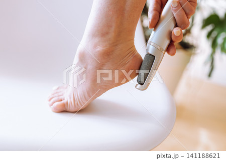 foot skin care peeling, massage, moisturizing 141188621