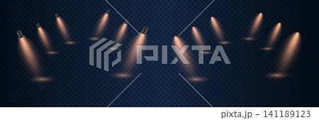 Multiple light beams from stage spotlights creating a dramatic warm glow on a dark backdrop Multiple light beams from stage spotlights creating a dramatic warm glow on a dark backdrop 141189123