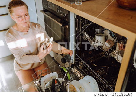 wash dishes in dishwasher wash dishes in dishwasher 141189164