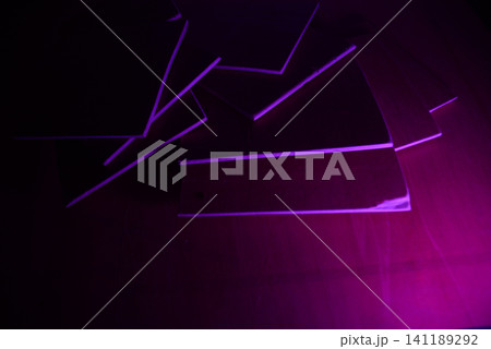 Abstract stack of paper sheets illuminated by magenta ultraviolet light 141189292