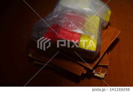 Close up of plastic wrapped laminate flooring tiles with flooring, laminate 141189298
