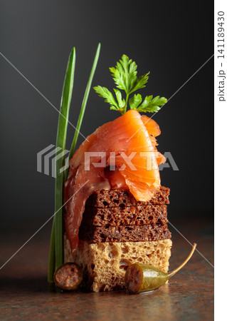 Open sandwich with smoked salmon and capers. 141189430