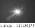Glowing light effect with starburst and lens flare on a transparent background 141189475