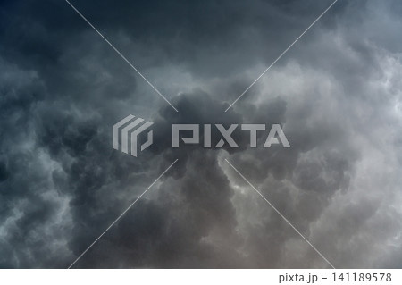 panoramic view of a cloudscape of a sky with a gloomy dark storm clouds panoramic view of a cloudscape of a sky with a gloomy dark storm clouds 141189578