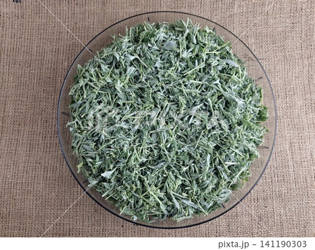 Top View of Chopped Bitter Wormwood in a Glass Bowl Top View of Chopped Bitter Wormwood in a Glass Bowl 141190303
