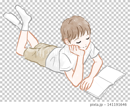 A boy reading a book while lying down A boy reading a book while lying down 141191646