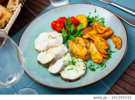 Hake fish dish, parsley, pickled tomatoes Hake fish dish, parsley, pickled tomatoes 141193332