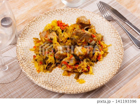 Just cooked portion of pork meat stewed with cabbage Just cooked portion of pork meat stewed with cabbage 141193396