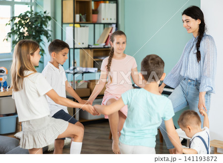Children stand together and do exercises Children stand together and do exercises 141193872