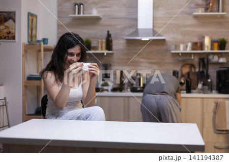 Desperate woman holding narcotic drugs in crisis with narcotics and dependency references showing substance abuse, health risk and personal crisis. Desperate woman holding narcotic drugs in crisis with narcotics and dependency references showing substance abuse, health risk and personal crisis. 141194387