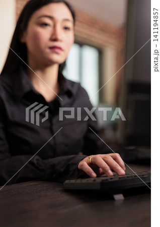 Software developer programs server code at a computer desk in an IT agency, focused on HTML algorithms and digital development workflow. Software developer programs server code at a computer desk in an IT agency, focused on HTML algorithms and digital development workflow. 141194857