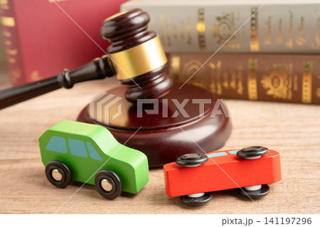 Car accident lawsuit and insurance, Judge hammer with car model. 141197296