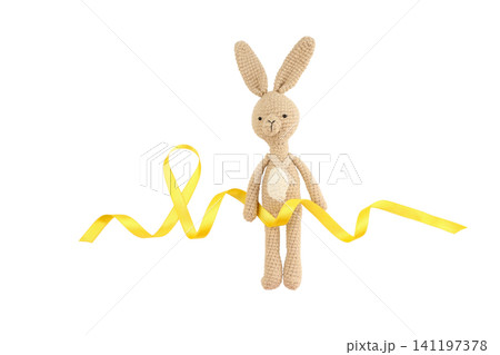 Cute crochet bunny standing with a yellow ribbon, isolated on white, PNG Cute crochet bunny standing with a yellow ribbon, isolated on white, PNG 141197378