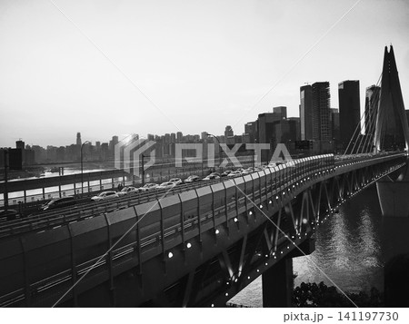 Chongqing cityscape with illuminated bridge and skyline at night in black and white Chongqing cityscape with illuminated bridge and skyline at night in black and white 141197730