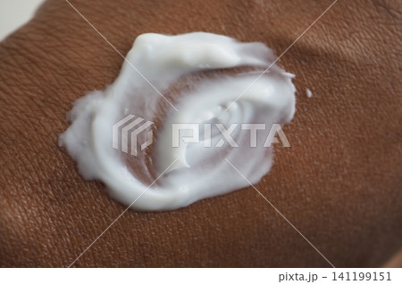 Applying cream on skin for moisture and care Applying cream on skin for moisture and care 141199151