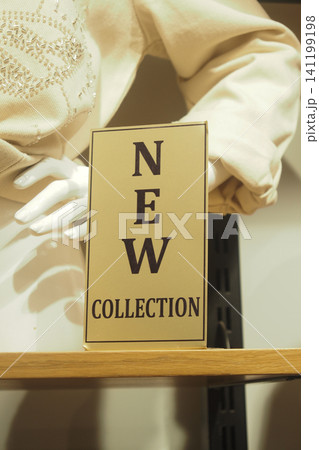 New collection sign in a retail store display 141199198