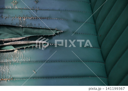 Worn leather reveals history of use in vintage chair Worn leather reveals history of use in vintage chair 141199367