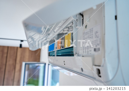 Open air conditioner with visible filters ready for cleaning and maintenance 141203215