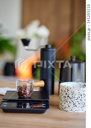 Coffee beans on scale before grinding 141203219