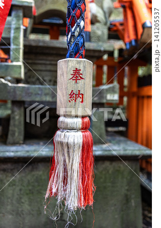 Suzu bell rope hanging at fushimi inari taisha shrine Suzu bell rope hanging at fushimi inari taisha shrine 141205537
